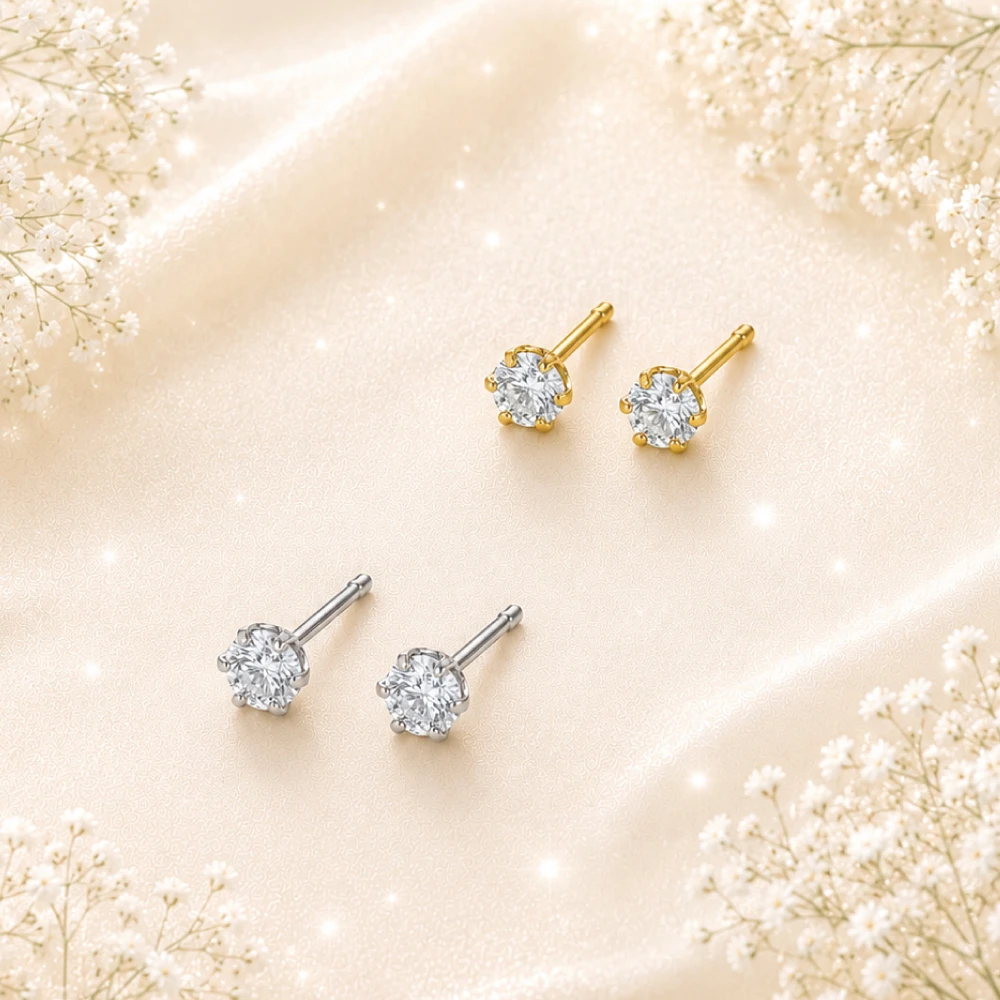 プラチナとK18イエローゴールドの一粒ダイヤモンドピアス